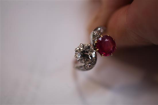 A gold, ruby and diamond crossover ring, size M.